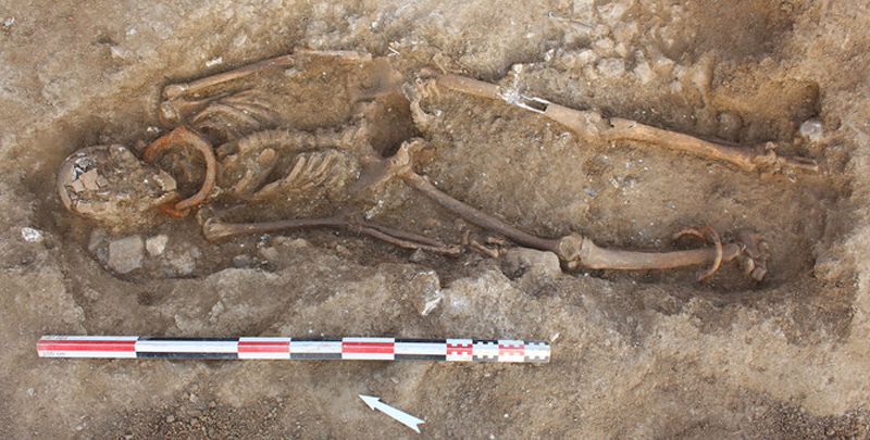 Illustration for article titled Skeletons Found In Ancient Cemetery Still Have Shackles On Their Necks